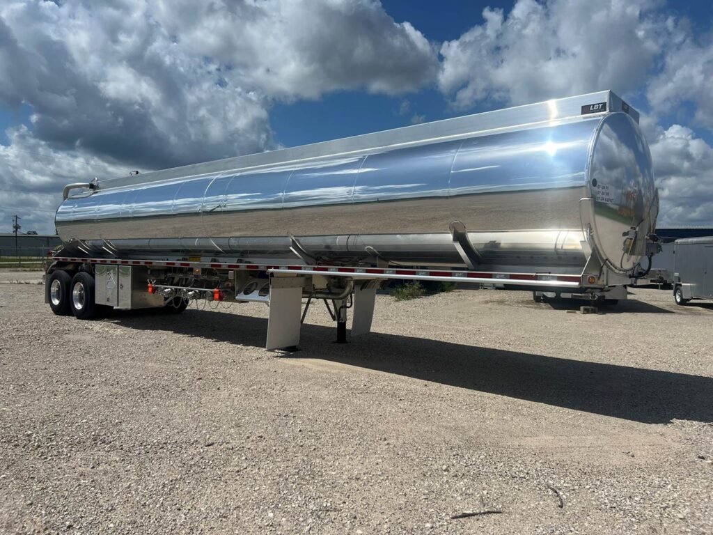 Aluminum tank trailer for fuel transport, durable and reliable, ideal for commercial fuel hauling.